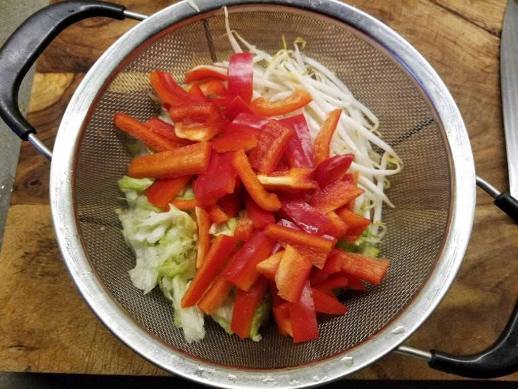 sliced red pepper and mung bean sprouts