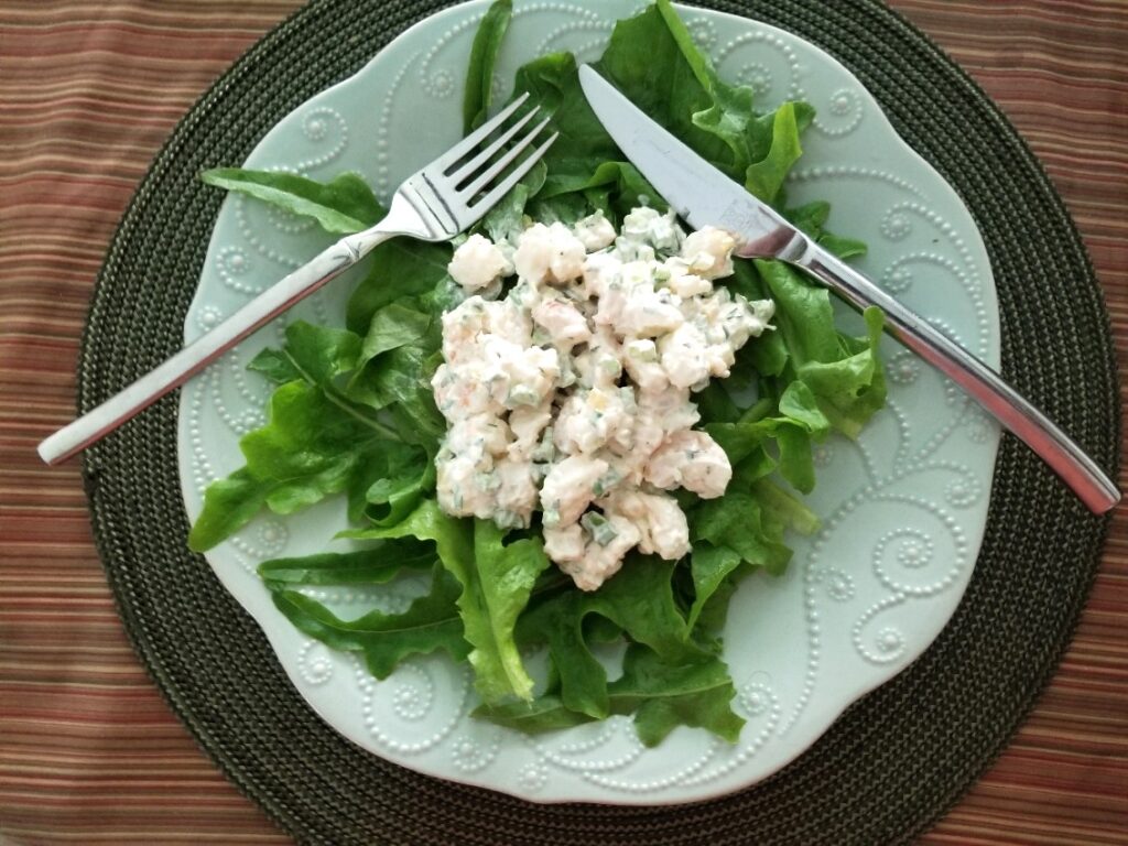 shrimp salad on a bed of lettuce