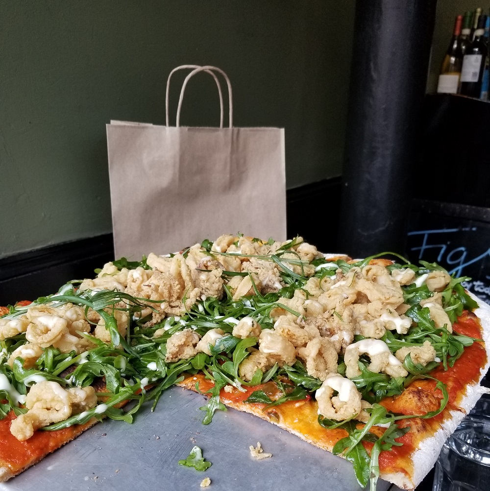 Fiery calamari and arugula pizza