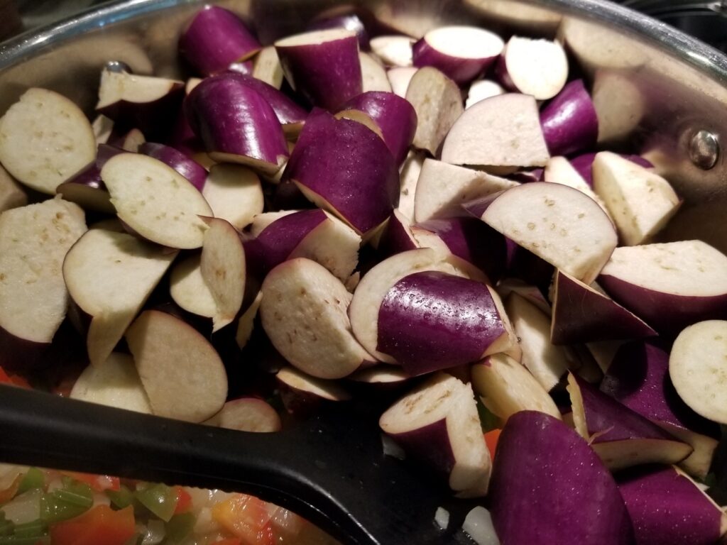 adding the eggplant to the caponata