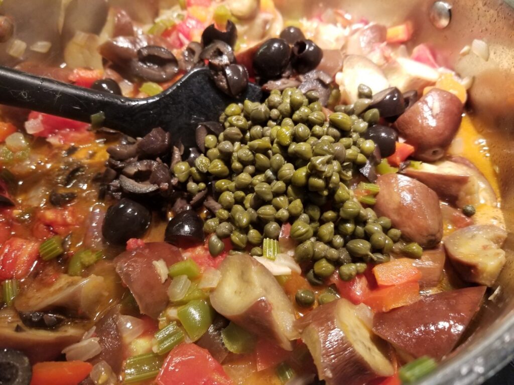 adding the punch to the caponata