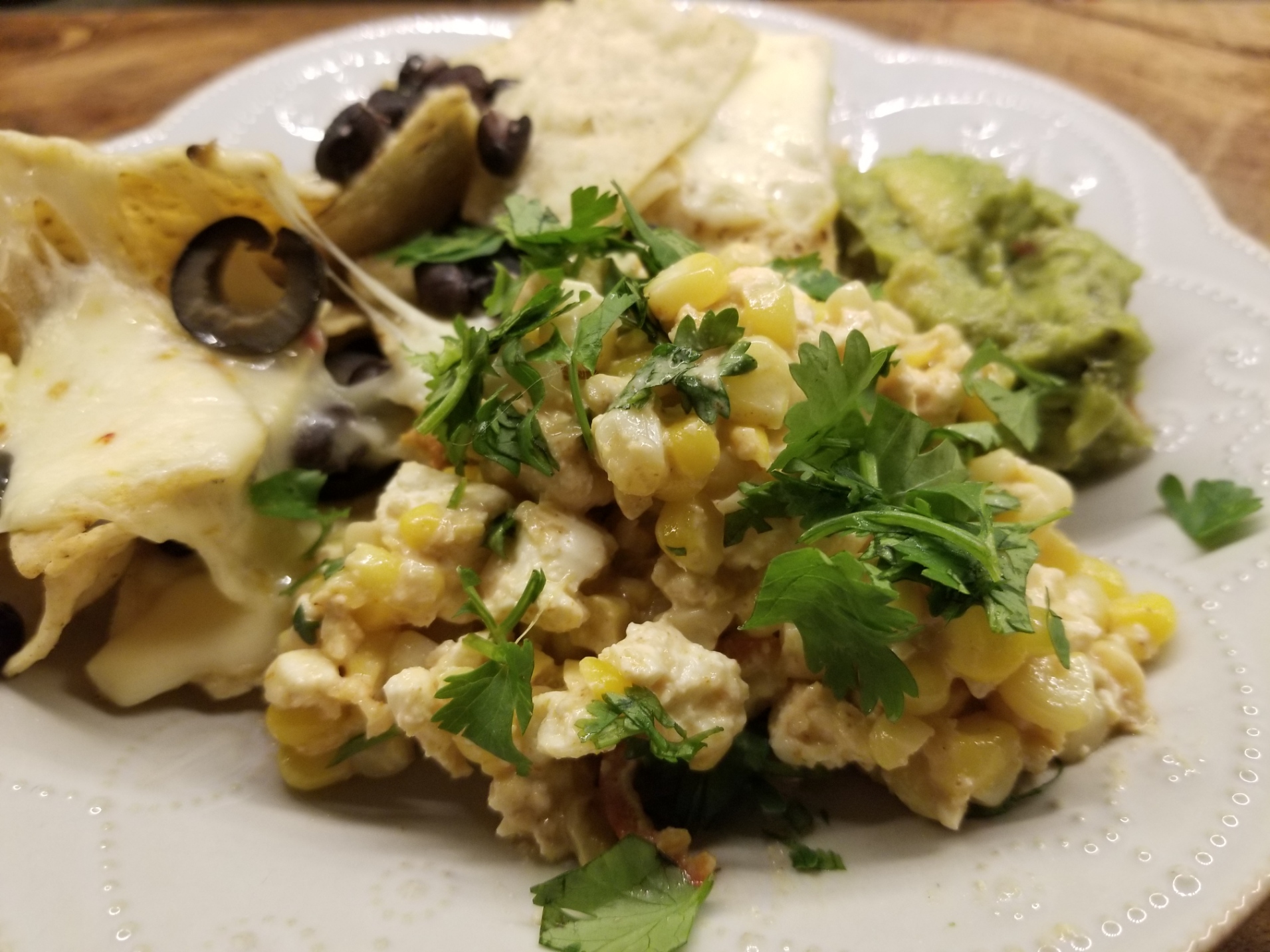 Spicy Corn and Feta, served with nachos and guac